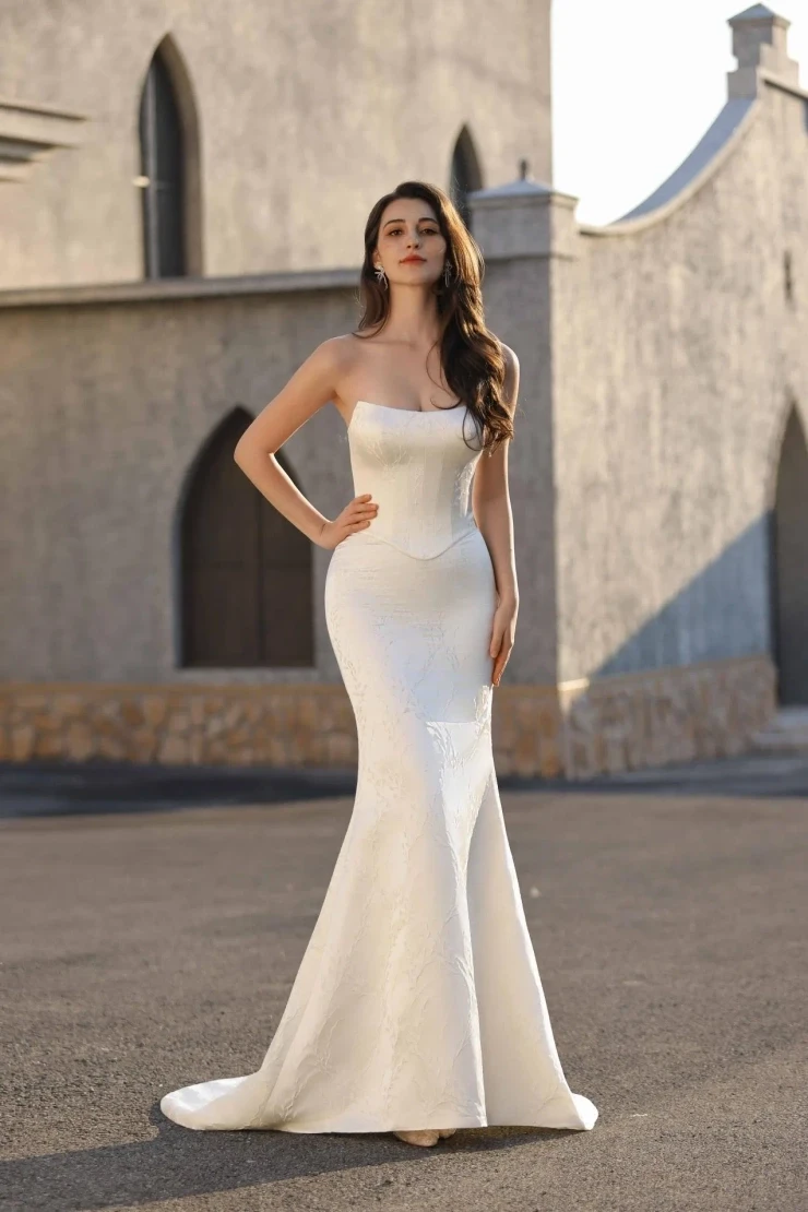 Model wearing a white dress
