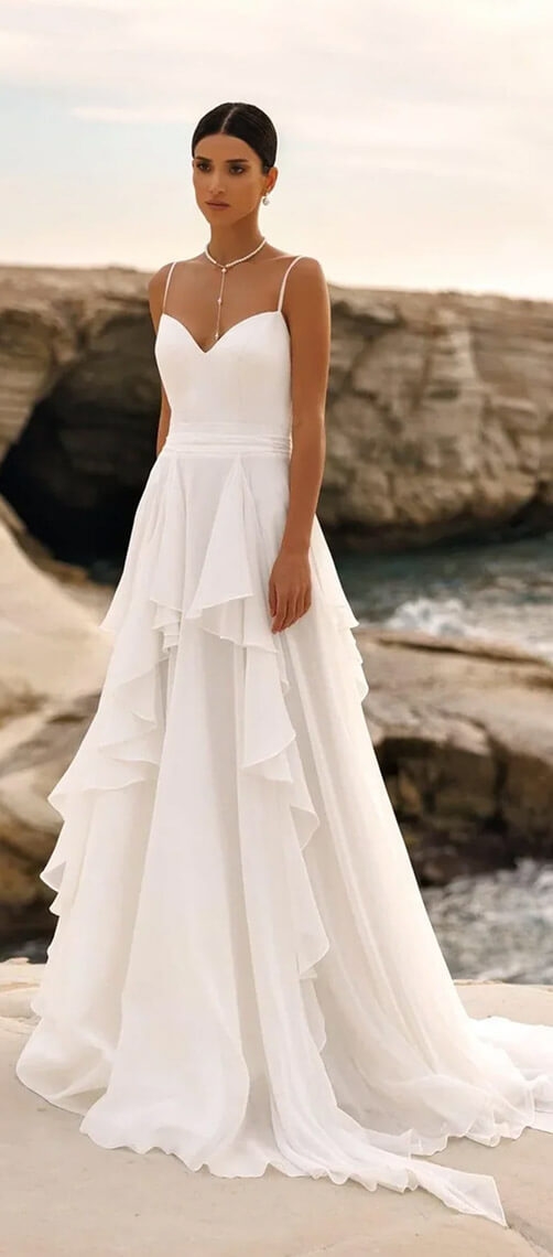 Model wearing a white dress